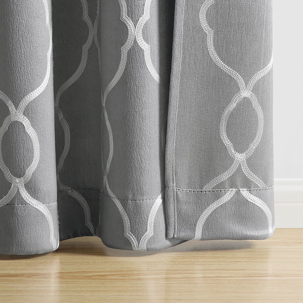 The bottom of a Alona Lattice dark grey panel where it meets the floor