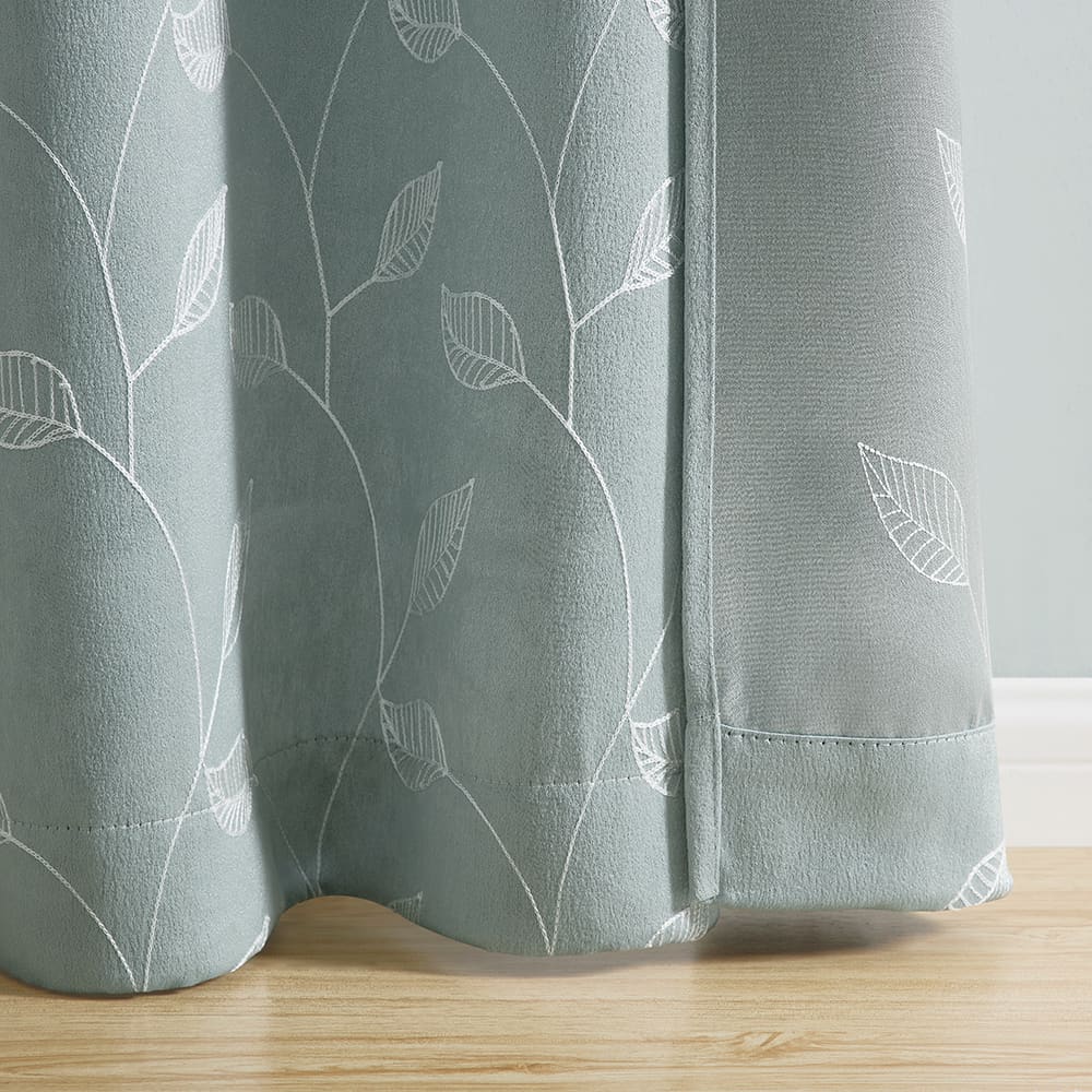 The bottom of a Alona Leaves aqua panel where it meets the floor