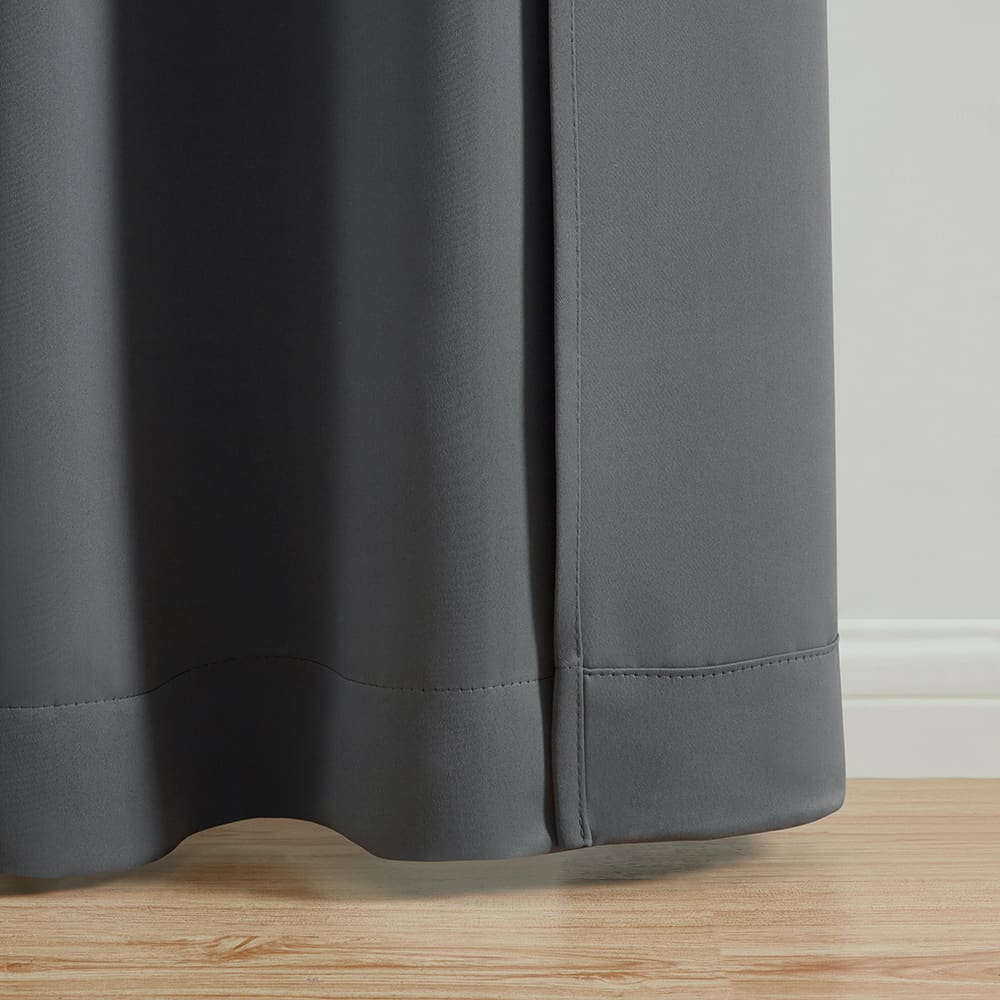 The bottom of a Alona grey panel where it meets the floor