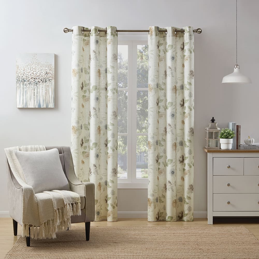 Blooming light filtering curtains in floral at a window in a furnished room