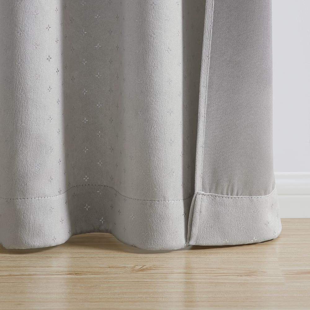 The bottom of a Marquee grey with silver foil panel where it meets the floor