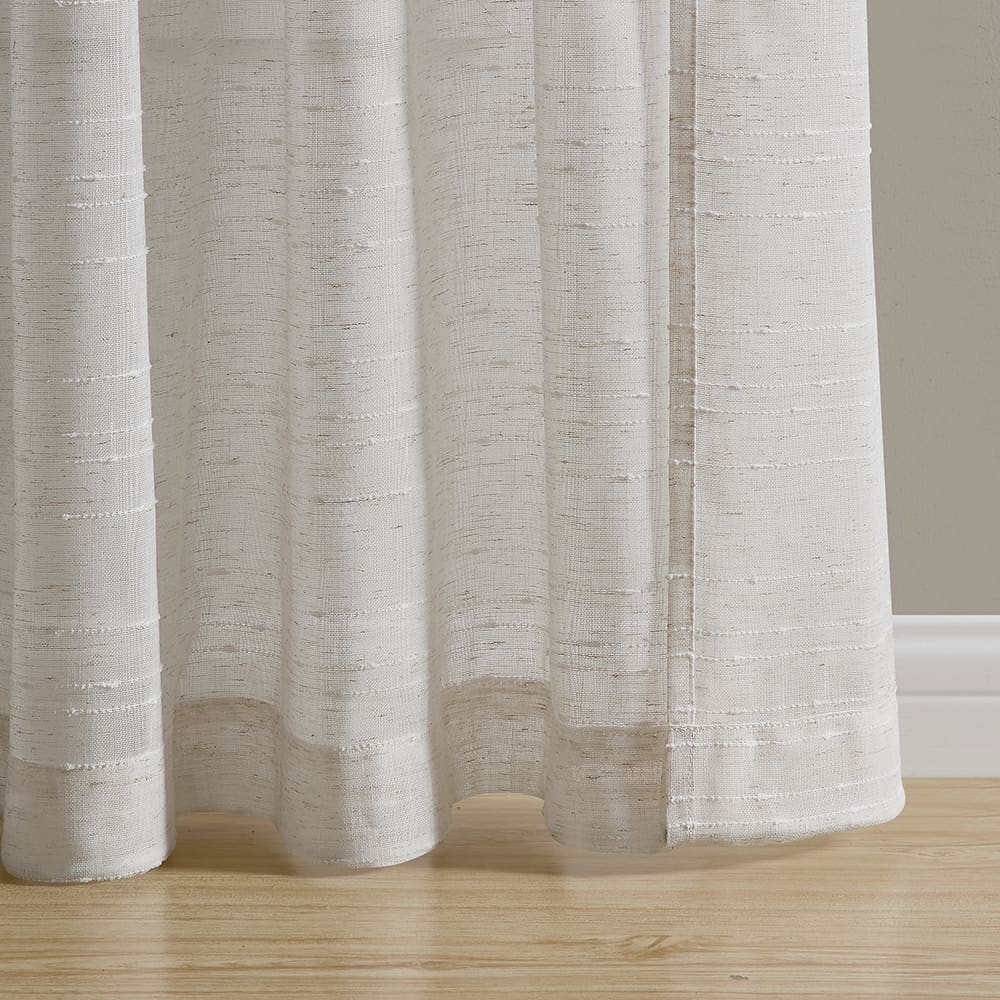 The bottom of a Sasha linen panel where it meets the floor