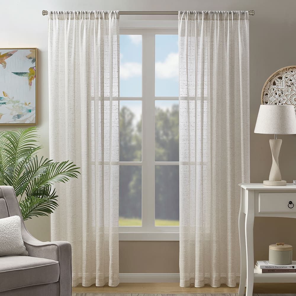 Sasha sheers in linen at a window, daylight through the weave