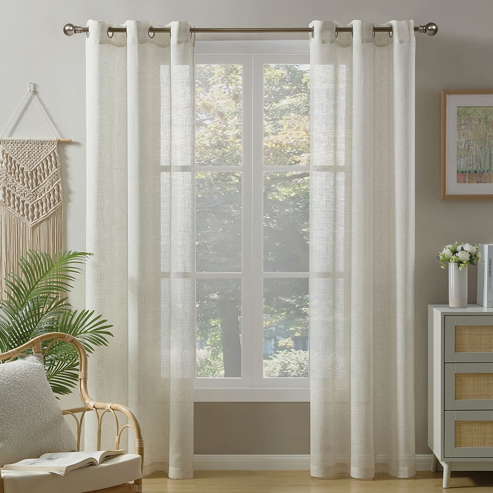 Valencia light filtering curtains in natural linen blend at a window in a furnished room