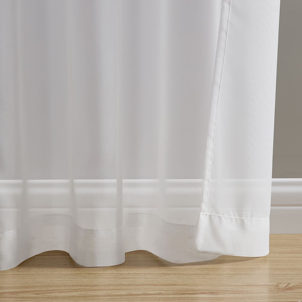 The bottom of a Voile white panel where it meets the floor
